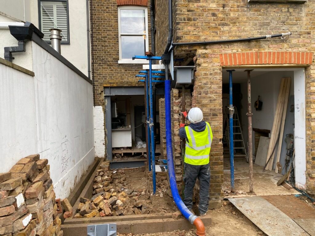 Structural work in progress during rear extension construction in Richmond by Torwood Interiors.