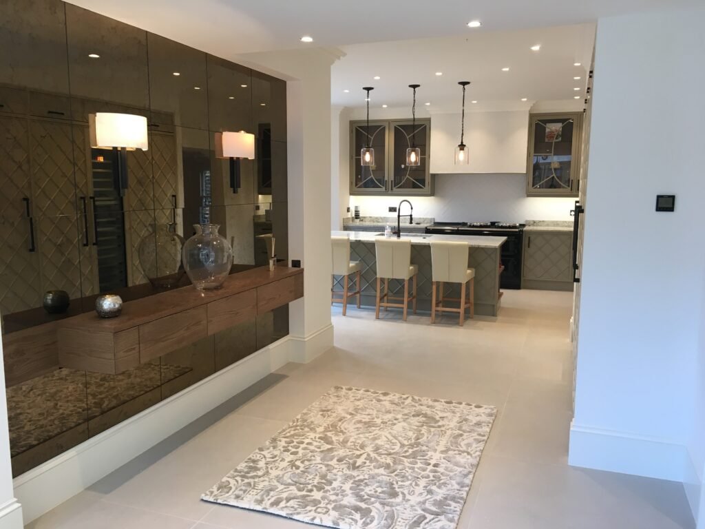 Bronze-mirror feature wall and bespoke cabinetry Richmond TW9