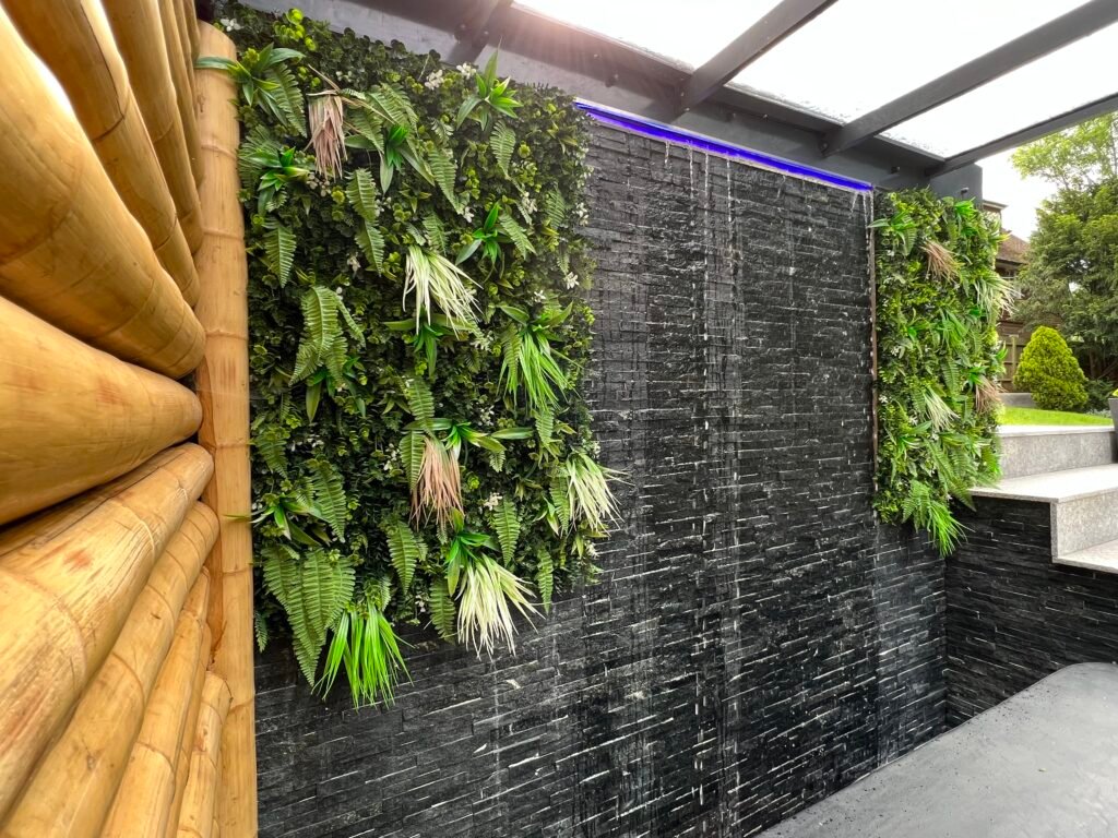 Vertical garden wall with waterfall feature in Purley by Torwood Interiors